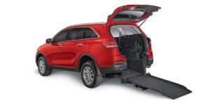 red Kia Sorento converted into a rear access wheelchair ramp