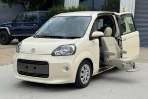 Cream Toyota Porte showing mobility swivel seat and sliding door
